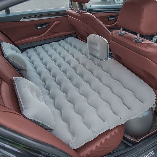 Wave-Shaped Inflatable Car Bed shown inflated in a vehicle's backseat for travel comfort.
